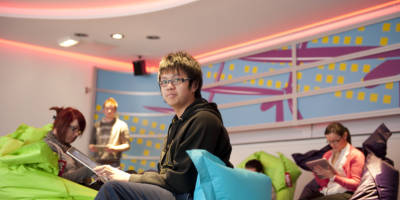 Students relaxing on beanbags in SWC common area