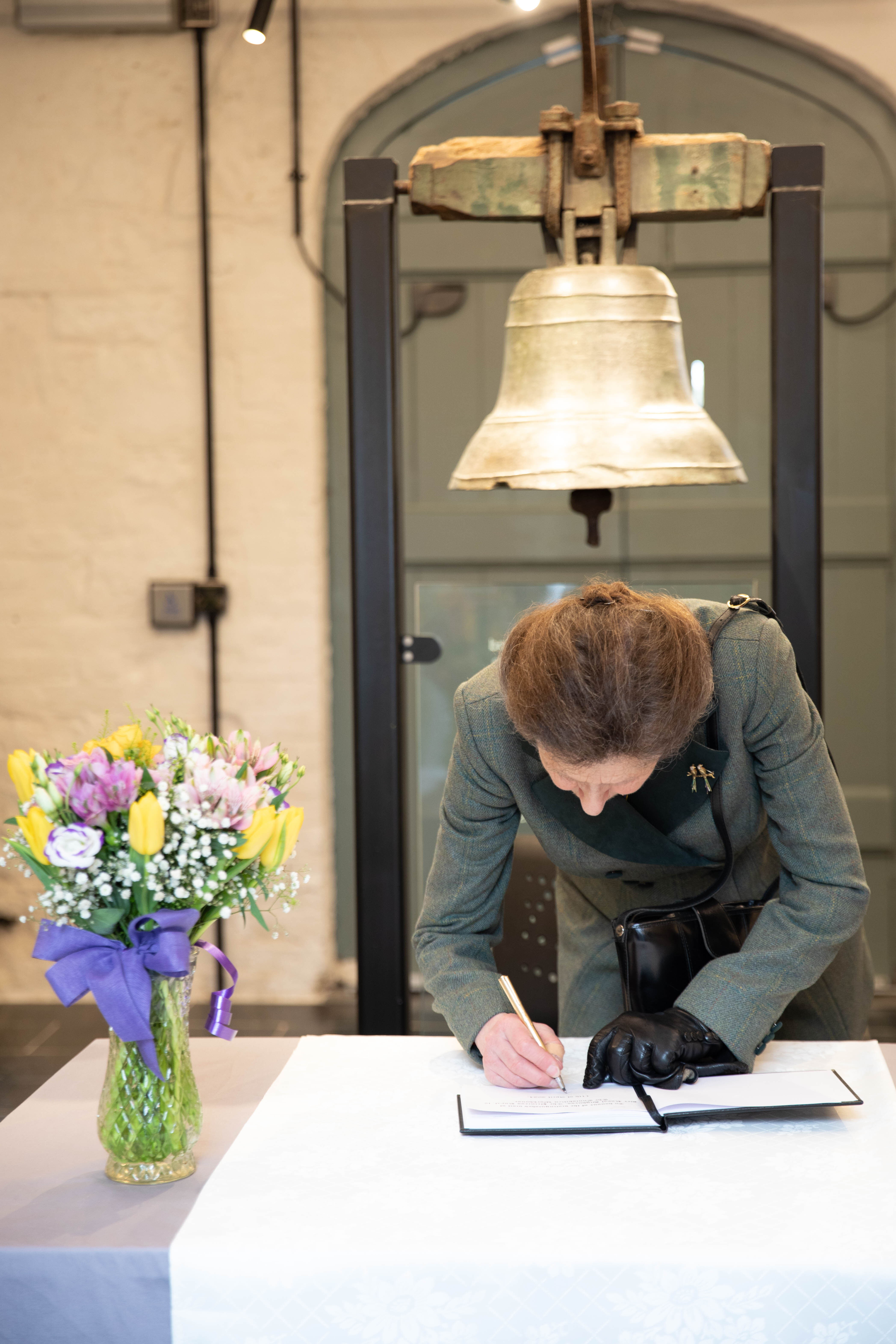 Her Royal Highness, The Princess Royal signs the visitor book at Enniskillen Workhouse